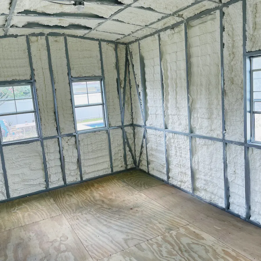 Closed-cell spray foam insulation applied to wall cavities in a residential project in Angleton